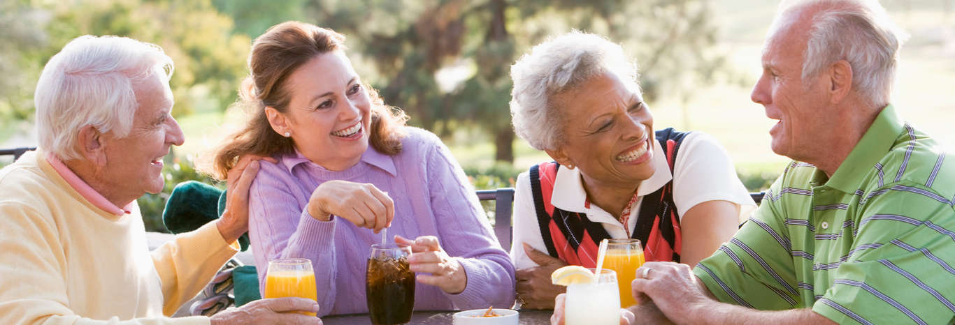 a group of seniors enjoying a beverage outdoors