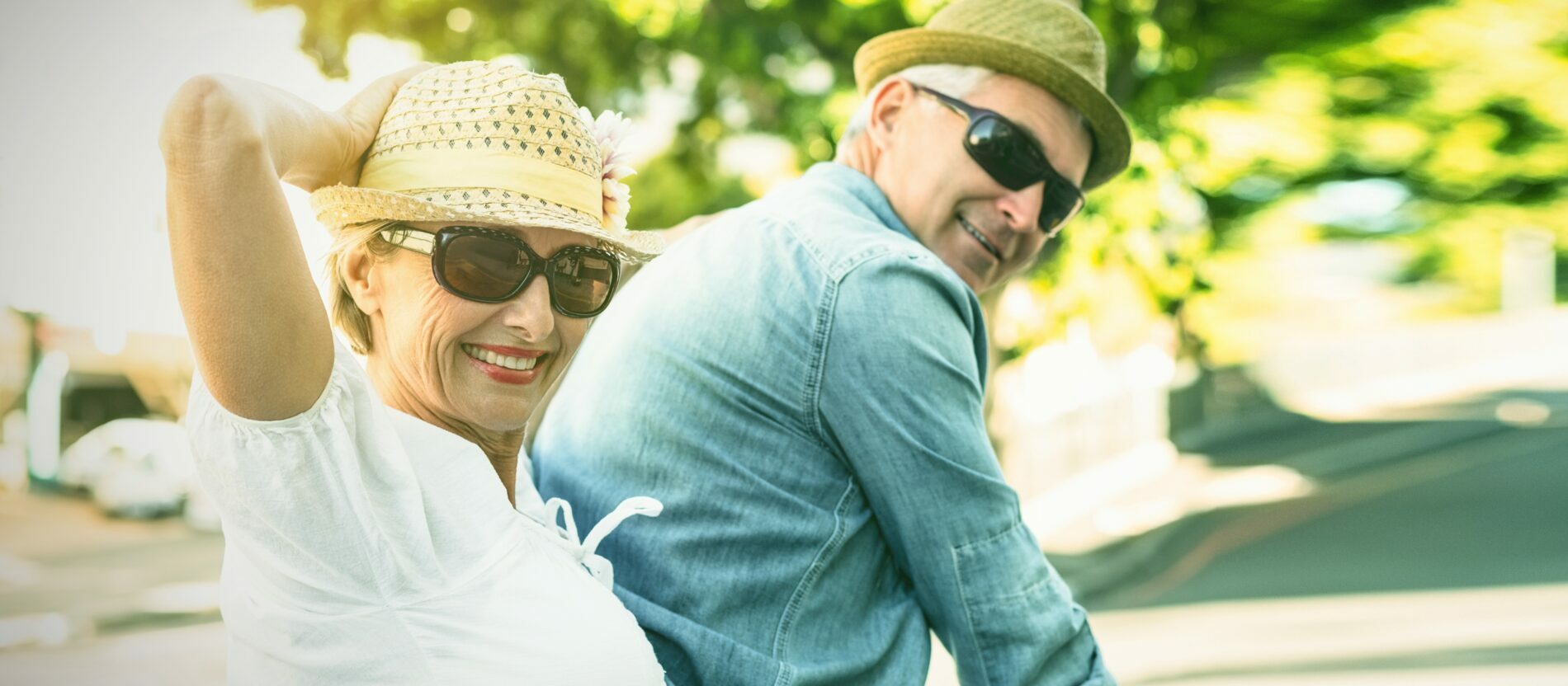 A happy senior couple wearing sunglasses