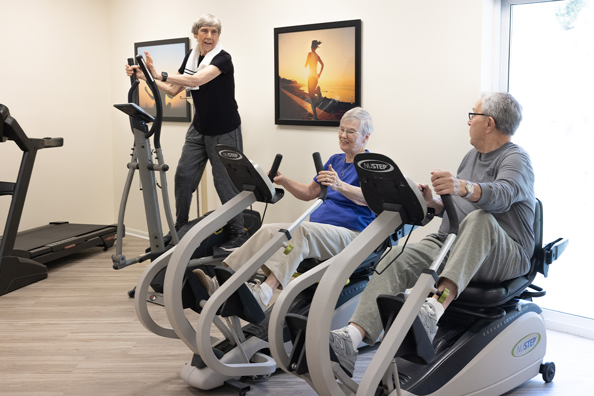Residents working out in the Fitness Center at Bloomfield Senior Living Community in Omaha Nebraska.