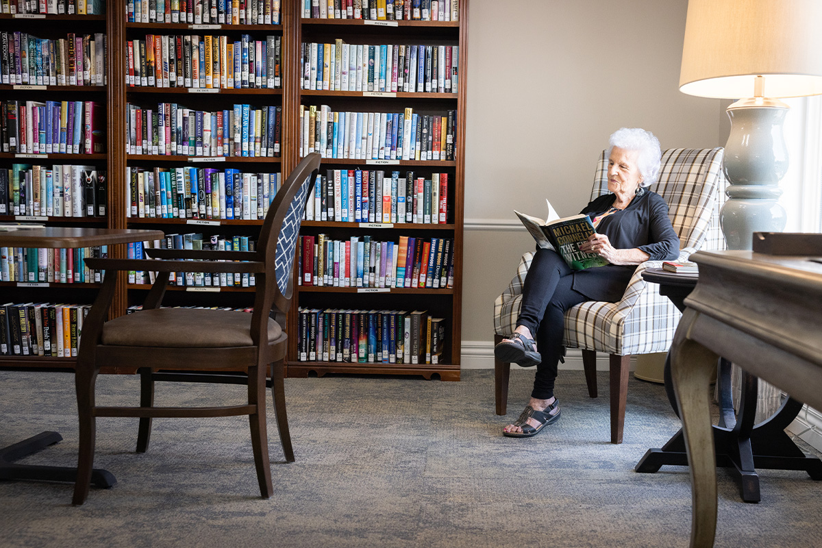 Spacious and cozy library at Bloomfield Senior Living Community in Omaha Nebraska.