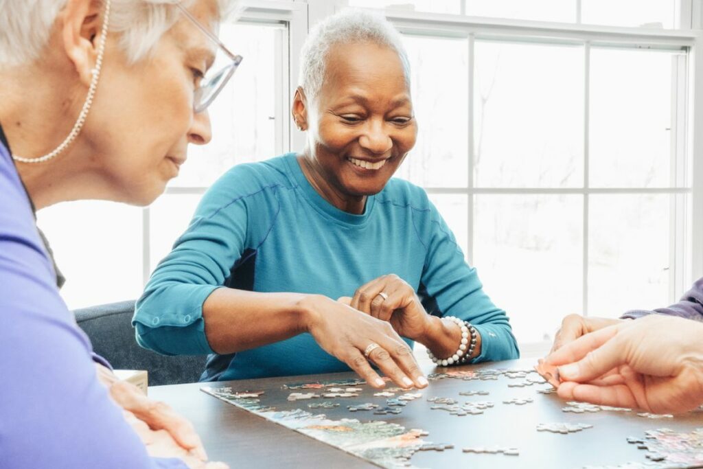 Recreation women playing puzzle