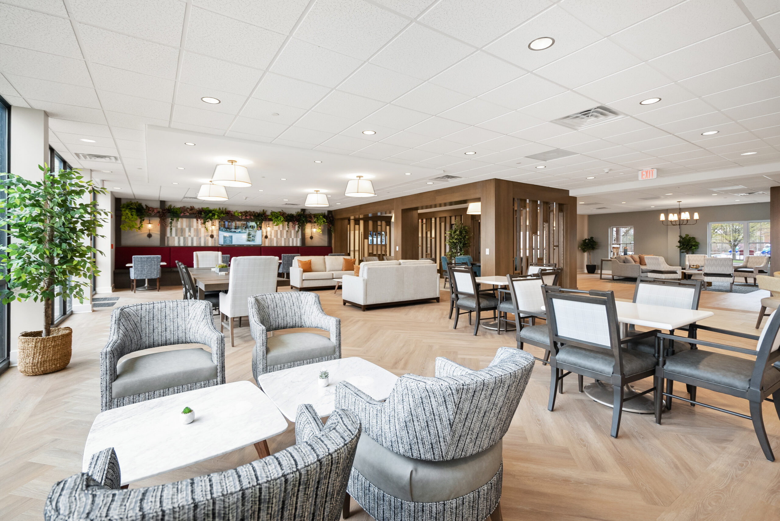 Cozy chairs and dining tables create a comfortable and welcoming atmosphere at Arbour Square of Harleysville PA Senior Living Community.