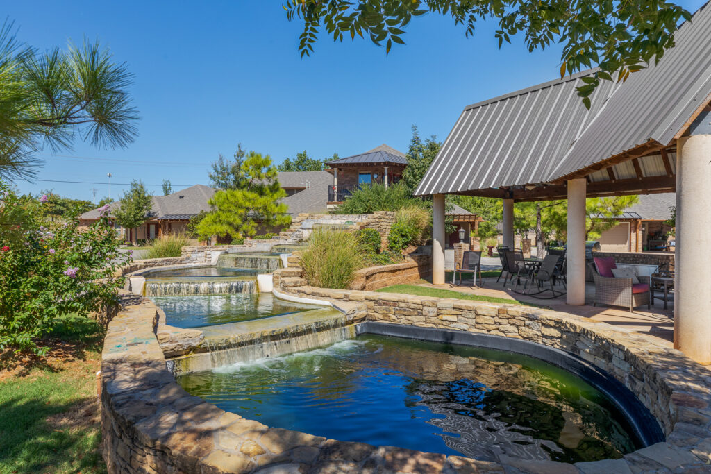 Cascading pond in Mon Abri 55+ active senior living community in Oklahoma.