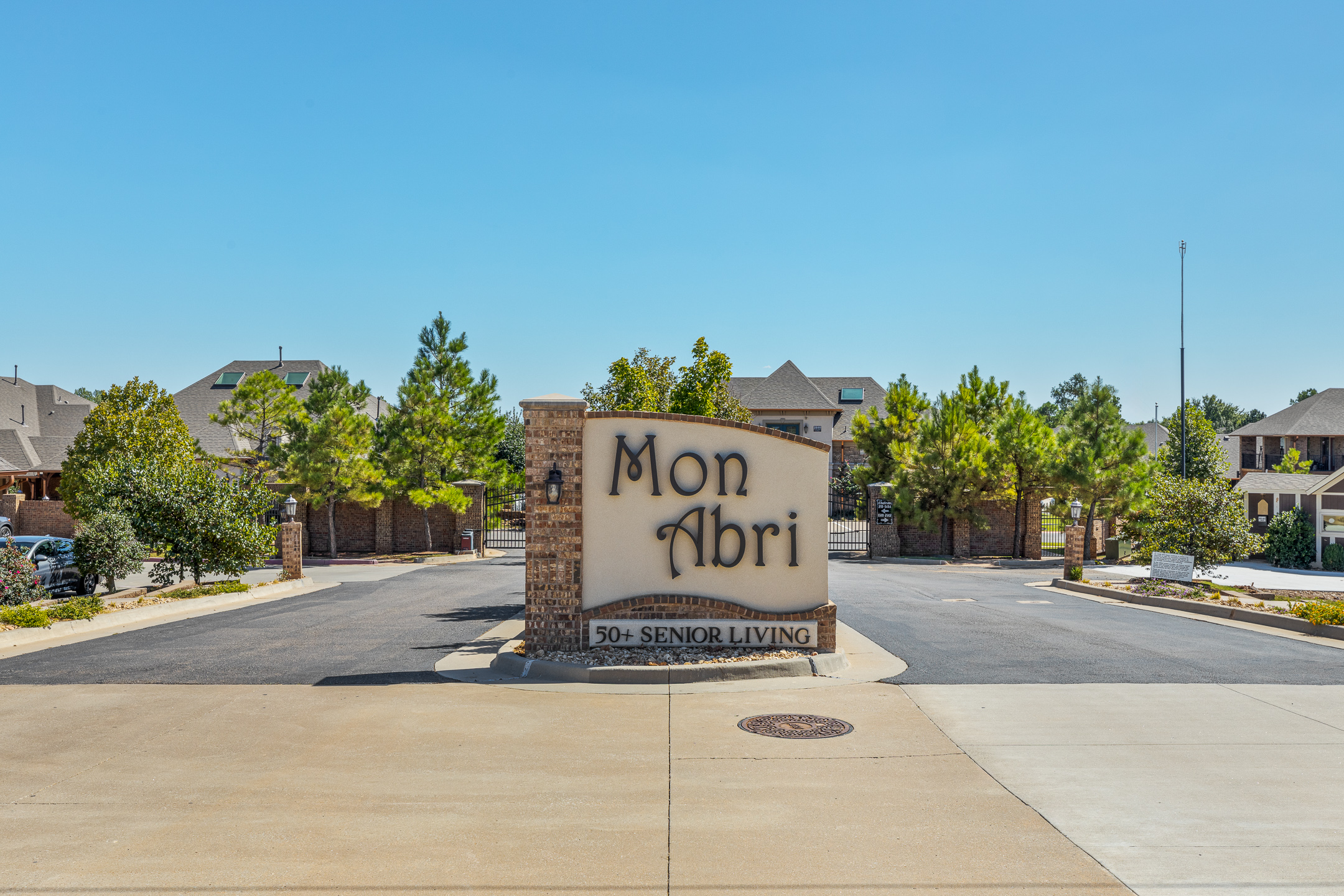 Front entrance to Mon Abri 55+ active senior living community in Oklahoma.