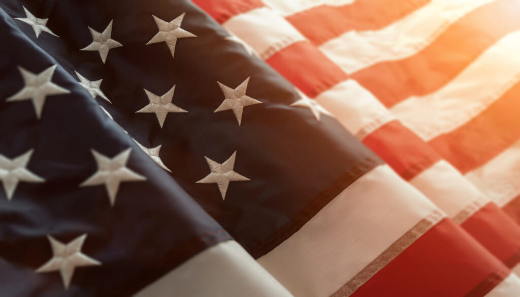 honor our fallen heros flag waiving in the wind