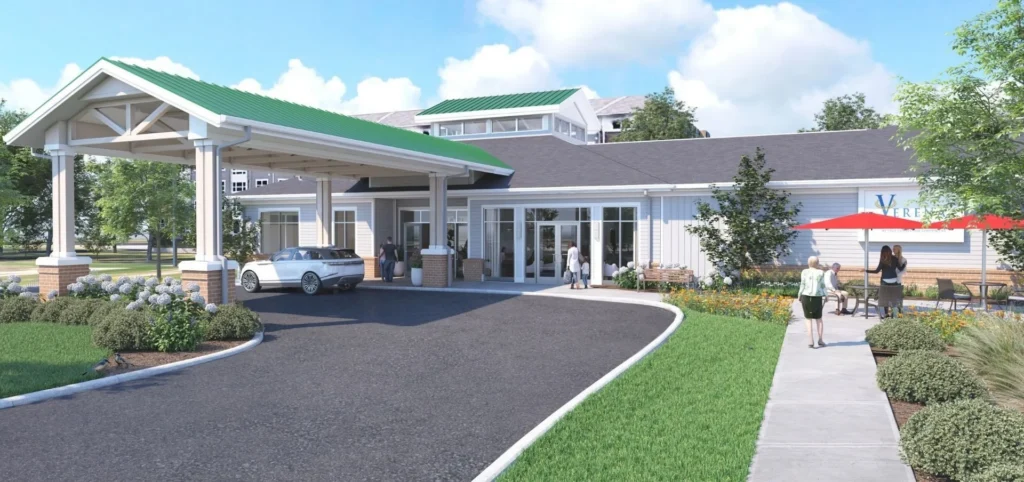 Architectural rendering of a single-story building with a covered entrance, a curved driveway and landscaped grounds