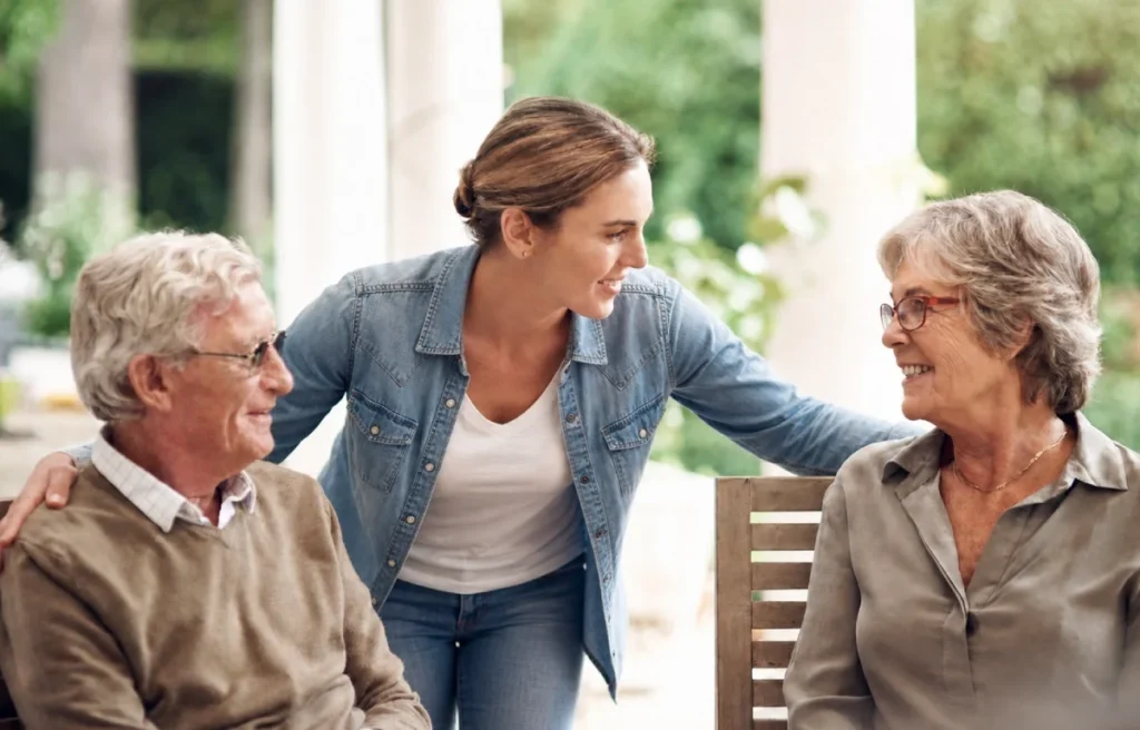 Caregiver checking in on senior residents