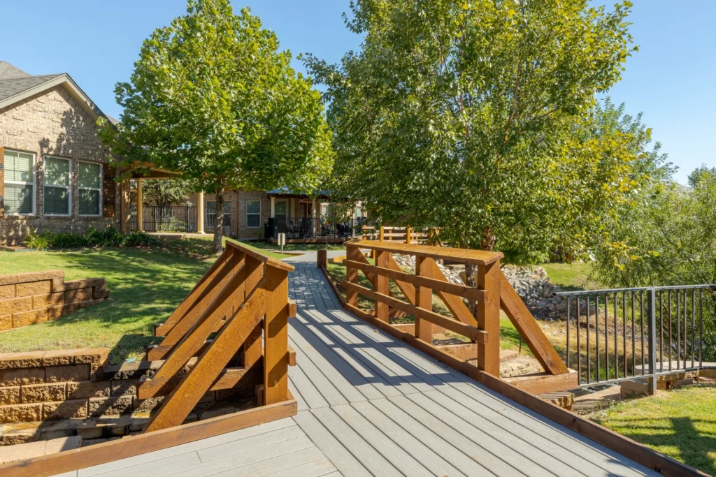 Mon Abri community wooden footbridge and residences