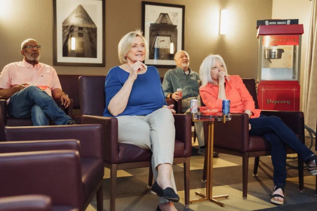 Pine Ridge of Plumbrook residents watching a movie together