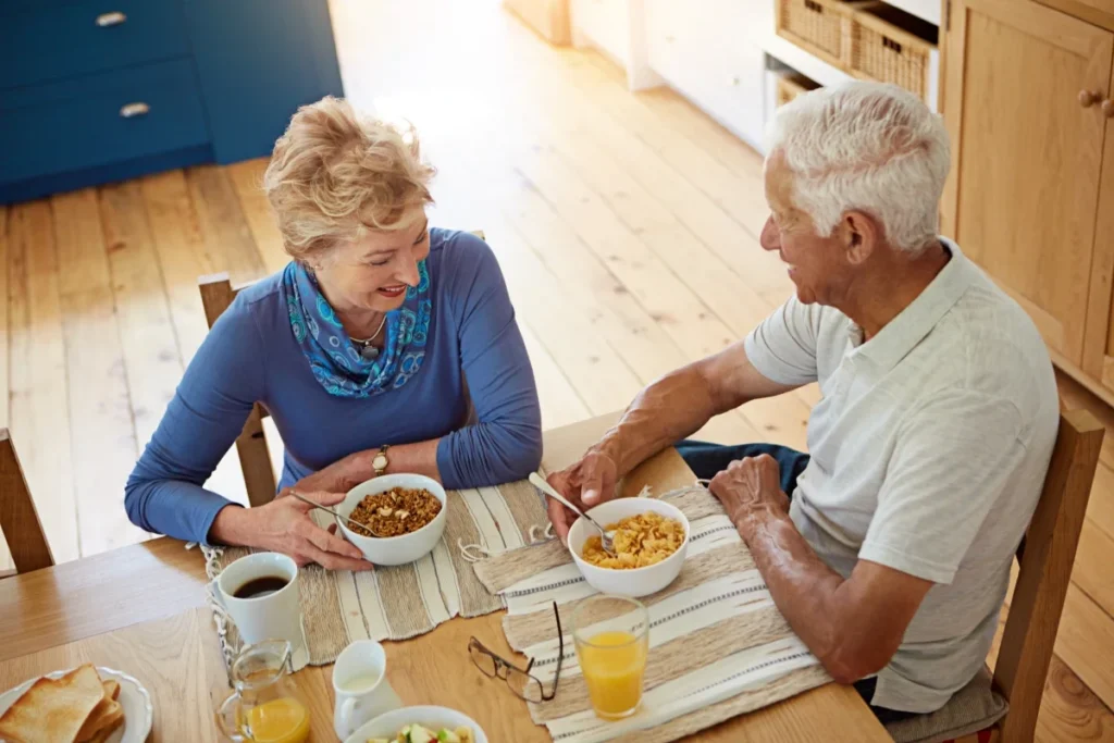 Senior couple having breakfast together at home