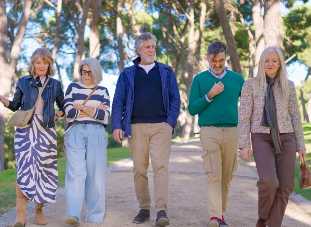 Group of seniors walking outside on a path together