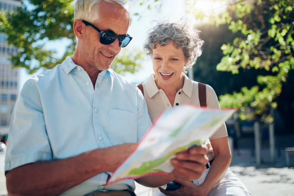 Senior man and woman reading map together