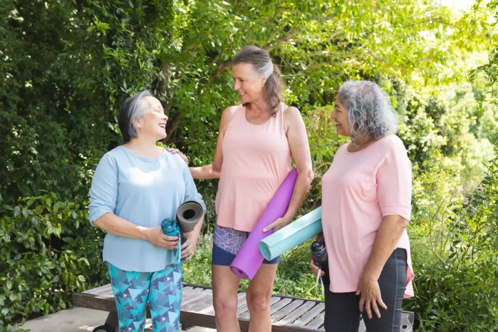 Senior women friends chatting together outdoors