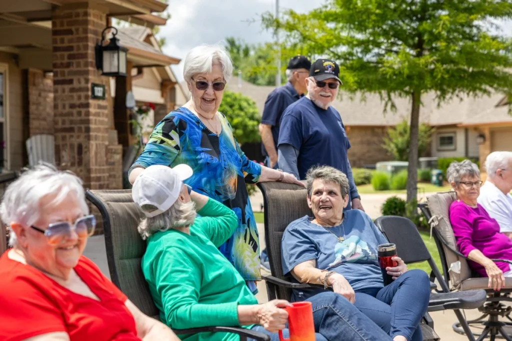 Seniors sitting together outside and chatting