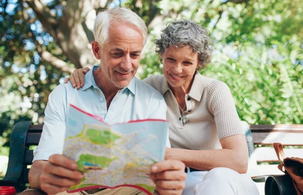 Older couple looking at a map together outdoors