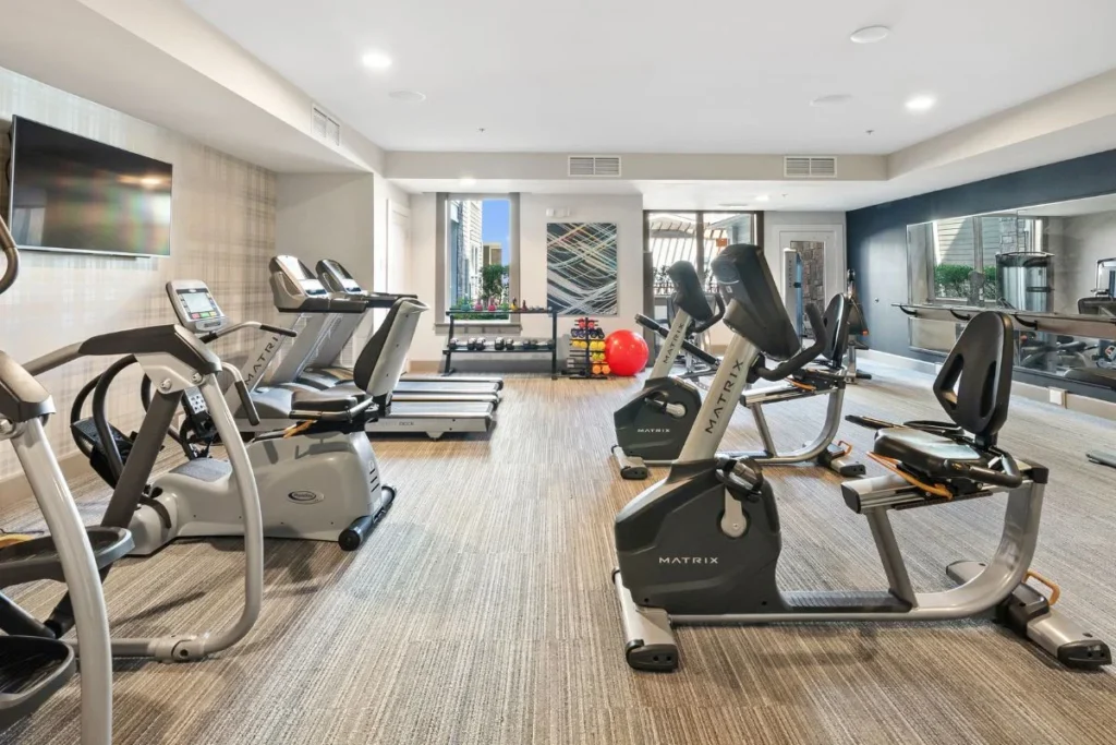 Fitness room with treadmills, elliptical machines and stationary bikes