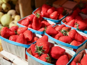Cartons of fresh strawberries at a market
