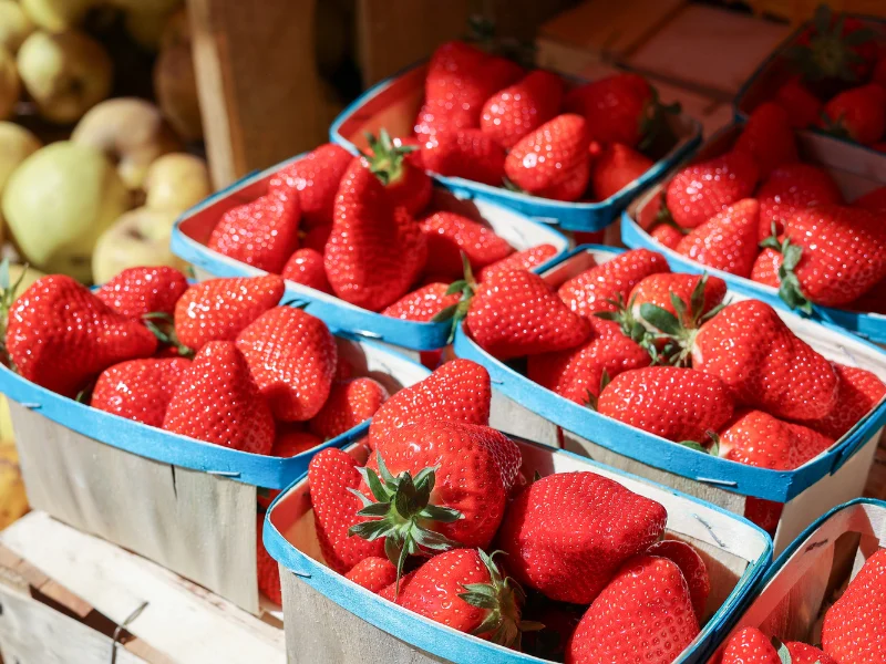 Cartons of fresh strawberries at a market